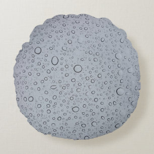 Selective focus photography of water droplets round pillow