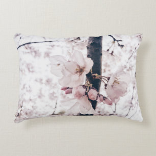 SELECTIVE FOCUS PHOTOGRAPHY OF WHITE AND PINK PETA ACCENT PILLOW