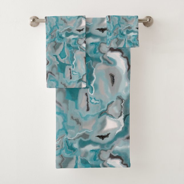 Serviette avec motif abstrait gris turquoise. (En situation)