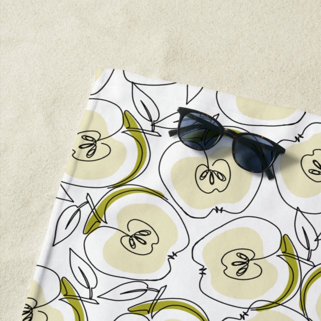 Serviette de plage avec pomme. (En situation)