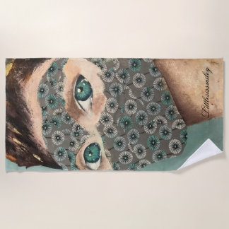 Serviette de plage de la femme masquée