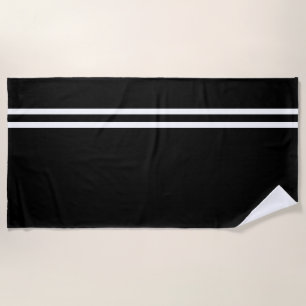 Serviette de plage noire aux lignes blanches