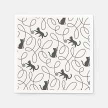 Motif de chat noir joueur et boule de laine