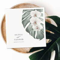 Orchidées blanches sur Monstera Mariage tropical