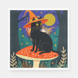 Serviette En Papier Une petite chatte noire de sorcière assise sur un
