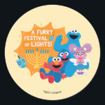 Sesame Street | A Furry Festival of Lights! Classic Round Sticker<br><div class="desc">Celebrate Hanukkah with your favourite Sesame Street friends in this delightful “A Furry Festival of Lights!” design! Featuring Cookie Monster, Elmo, Grover, and Abby Cadabby, this festive illustration captures the joy and warmth of the holiday season. Surrounded by a glowing menorah, playful dreidels, and cheerful smiles, this design is perfect...</div>