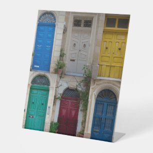 Set of colorful front doors in Malta Pedestal Sign