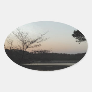 Setting Sun, Rising Moon over Lake Arrowhead Oval Sticker