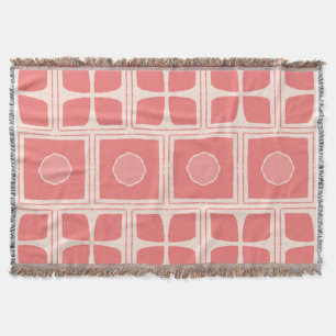 shades of coral pink & a light cream or off-white throw blanket