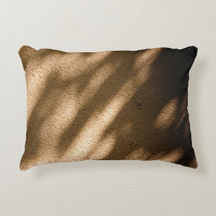 Shadow on brown carpeted floor accent pillow