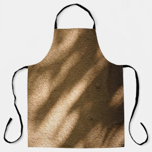 Shadow on brown carpeted floor apron