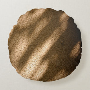 Shadow on brown carpeted floor round pillow
