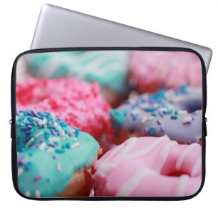 SHALLOW FOCUS PHOTOGRAPHY OF ASSORTED DOUGHNUTS WI LAPTOP SLEEVE
