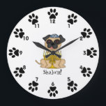 Shalom!-Cute Pug dog with Menorah Large Clock<br><div class="desc">This is a cute little wall clock for your child's room, featuring a sweet little cartoon Pug dog wearing a yarmulke, and a menorah in front of him. Around the edges, next to the numbers are cute little paw prints! Below the dog is the word "Shalom!" You can customize the...</div>