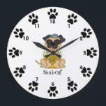 Shalom!-Cute Pug dog with Menorah Large Clock<br><div class="desc">This is a cute little wall clock for your child's room, featuring a sweet little cartoon Pug dog wearing a yarmulke, and a menorah in front of him. Around the edges, next to the numbers are cute little paw prints! Below the dog is the word "Shalom!" You can customize the...</div>