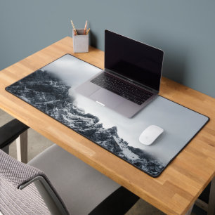 Sharp edges of mountains and soft clouds desk mat