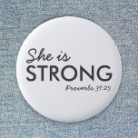 She is Strong | Proverbs 31:25 Christian Faith 2 Inch Round Button<br><div class="desc">Simple,  stylish christian scripture quote art design with bible verse "She is Strong - Proverbs 31:25" in modern minimalist typography in off black. This trendy,  modern faith design is the perfect gift and fashion statement. | #christian #religion #scripture #faith #bible #jesus #bethelight</div>