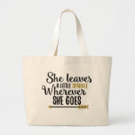 "She leaves a little sparkle" tote bag<br><div class="desc">A beautiful quote to remind the girl in your life how much she sparkles and shines! A great gift or personal tote for any activity!</div>