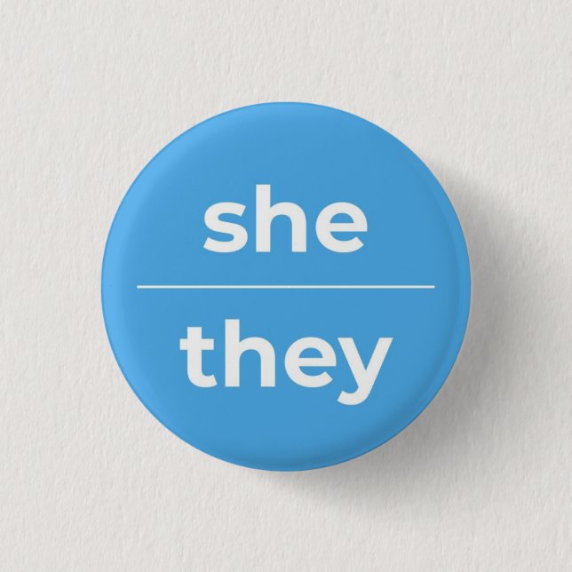 She/They Pronoun Pin, 1¼ Inch Button (Front)