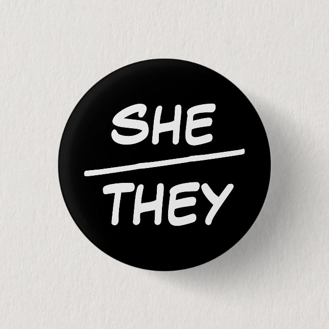 She/They Pronouns Black & White Badge 1 Inch Round Button (Front)