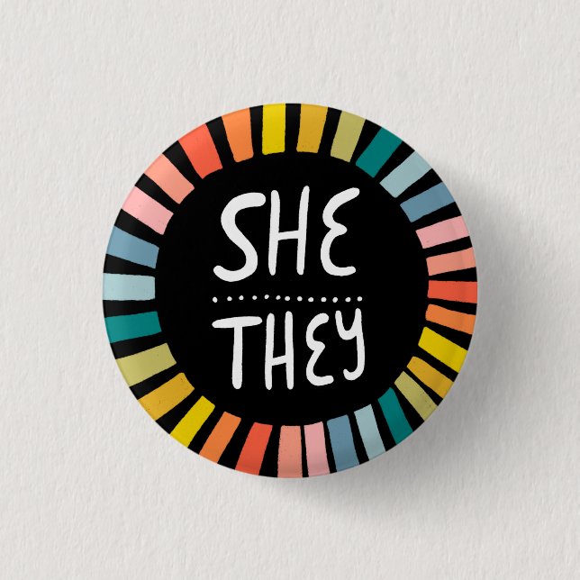 SHE / THEY Pronouns Rainbow Handlettered Pride 1 Inch Round Button (Front)