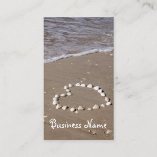 Shell heart on sandy beach business card