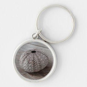 Shell On Top Of A Wooden Table Keychain