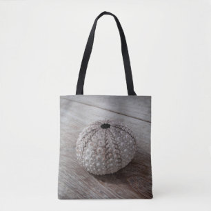 Shell On Top Of A Wooden Table Tote Bag