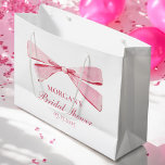 She's Tying The Knot Pink Bow Bridal Shower Large Gift Bag<br><div class="desc">Celebrate the bride-to-be with the "She's Tying The Knot" Pink Bow Bridal Shower Large Gift Bag. This lovely bag features a delicate pink bow design, adding an elegant touch to any bridal shower. Perfect for holding small gifts, treats, or party favours, this bag is both stylish and practical. Its soft...</div>