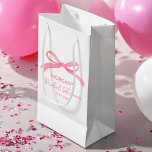 She's Tying The Knot Pink Bow Bridal Shower Small Gift Bag<br><div class="desc">Celebrate the bride-to-be with the "She's Tying The Knot" Pink Bow Bridal Shower Small Gift Bag. This lovely bag features a delicate pink bow design, adding an elegant touch to any bridal shower. Perfect for holding small gifts, treats, or party favours, this bag is both stylish and practical. Its soft...</div>