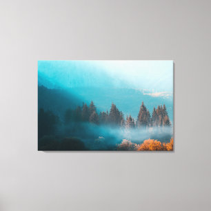 Shining light on foggy autumn forest canvas print