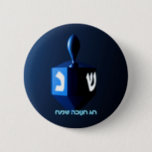 Shiny Blue Dreidel 2 Inch Round Button<br><div class="desc">A modernistic,  metallic blue dreidel against a dark,  night-like background.  Two of the Hebrew letters found on a dreidel,  nun and shin,  glow brightly.  Hebrew text reading "Chag Chanukkah Sameach" (Happy Hanukkah) also appears in glowing blue and white.</div>