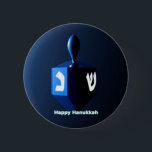 Shiny Blue Dreidel 2 Inch Round Button<br><div class="desc">A modernistic,  metallic blue dreidel against a dark,  night-like background.  Two of the Hebrew letters found on a dreidel,  nun and shin,  glow brightly.  Text reading "Happy Hanukkah" also appears in glowing blue and white.</div>
