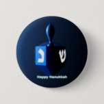 Shiny Blue Dreidel 2 Inch Round Button<br><div class="desc">A modernistic,  metallic blue dreidel against a dark,  night-like background.  Two of the Hebrew letters found on a dreidel,  nun and shin,  glow brightly.  Text reading "Happy Hanukkah" also appears in glowing blue and white.</div>