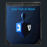 Shiny Blue Dreidel Drawstring Bag<br><div class="desc">A modernistic,  metallic blue dreidel against a dark,  night-like background.  Two of the Hebrew letters found on a dreidel,  nun and shin,  glow brightly.  Add your own text.</div>