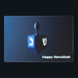 Shiny Blue Dreidel Laminated Placemat<br><div class="desc">On the front a modernistic, metallic blue dreidel against a dark, night-like background. Two of the Hebrew letters found on a dreidel, nun and shin, glow brightly. Text reading "Happy Hanukkah" also appears in glowing blue and white. On the reverse side is the same image with a place for you...</div>