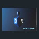 Shiny Blue Dreidel Laminated Placemat<br><div class="desc">On the front a modernistic, metallic blue dreidel against a dark, night-like background. Two of the Hebrew letters found on a dreidel, nun and shin, glow brightly. Hebrew text reading "Chag Chanukkah Sameach" (Happy Hanukkah) also appears in glowing blue and white. On the reverse side is the same image with...</div>