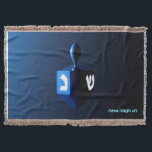 Shiny Blue Dreidel Throw Blanket<br><div class="desc">A modernistic, metallic blue dreidel against a dark, night-like background. Two of the Hebrew letters found on a dreidel, nun and shin, glow brightly. Hebrew text reading "Chag Chanukkah Sameach" (Happy Hanukkah) also appears in glowing blue and white.</div>