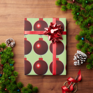 Shiny Red Ball Merry Christmas Ornaments on Green Wrapping Paper