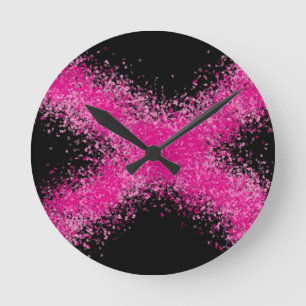 Shocking pink glitter confetti cross on black round clock