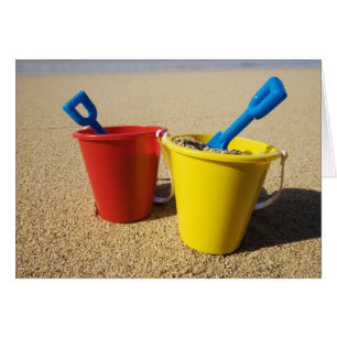 Shovels And Pails On Sandy Beach