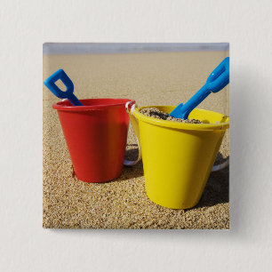 Shovels And Pails On Sandy Beach 2 Inch Square Button