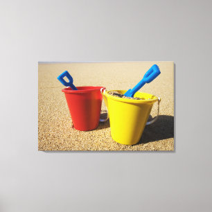 Shovels And Pails On Sandy Beach Canvas Print