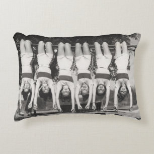 Showgirls on monkey bars, playful design. accent pillow