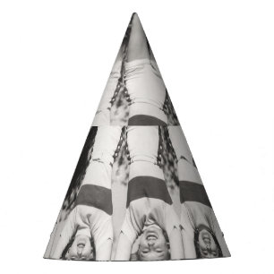 Showgirls on monkey bars, playful design. party hat