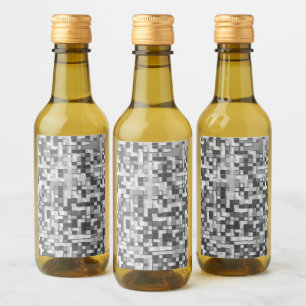 Shuffled small squares in tones of grey to clear wine label