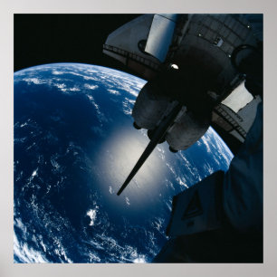 Shuttle Discovery docked with the ISS (STS-105) Poster
