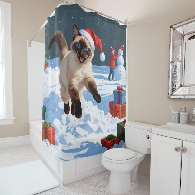 Siamese Cat Running in Snow with Christmas Hat (In Situ)