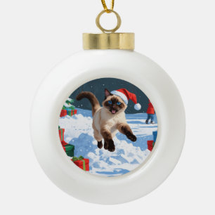 Siamese Cat Running in Snow with Christmas Hat Ceramic Ball Christmas Ornament