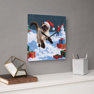 Siamese Cat Running in Snow with Christmas Hat Square Wall Clock